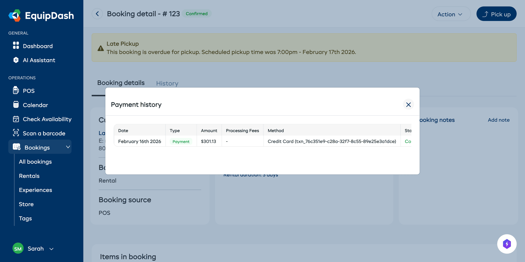 The payment history modal showing a table of transactions with date, type, amount, method, and status columns