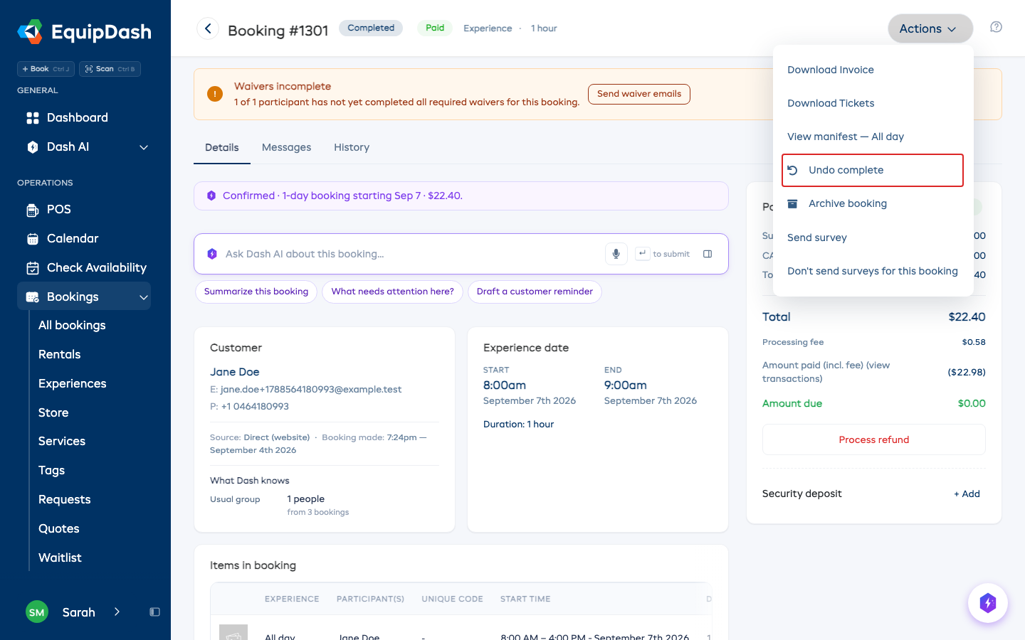 The Actions menu open on a completed experience booking, with the Undo complete option outlined.