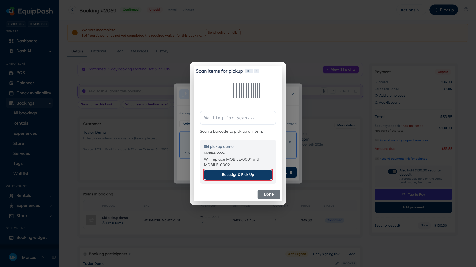 The scanner shows both identifiers before replacing an assigned item.