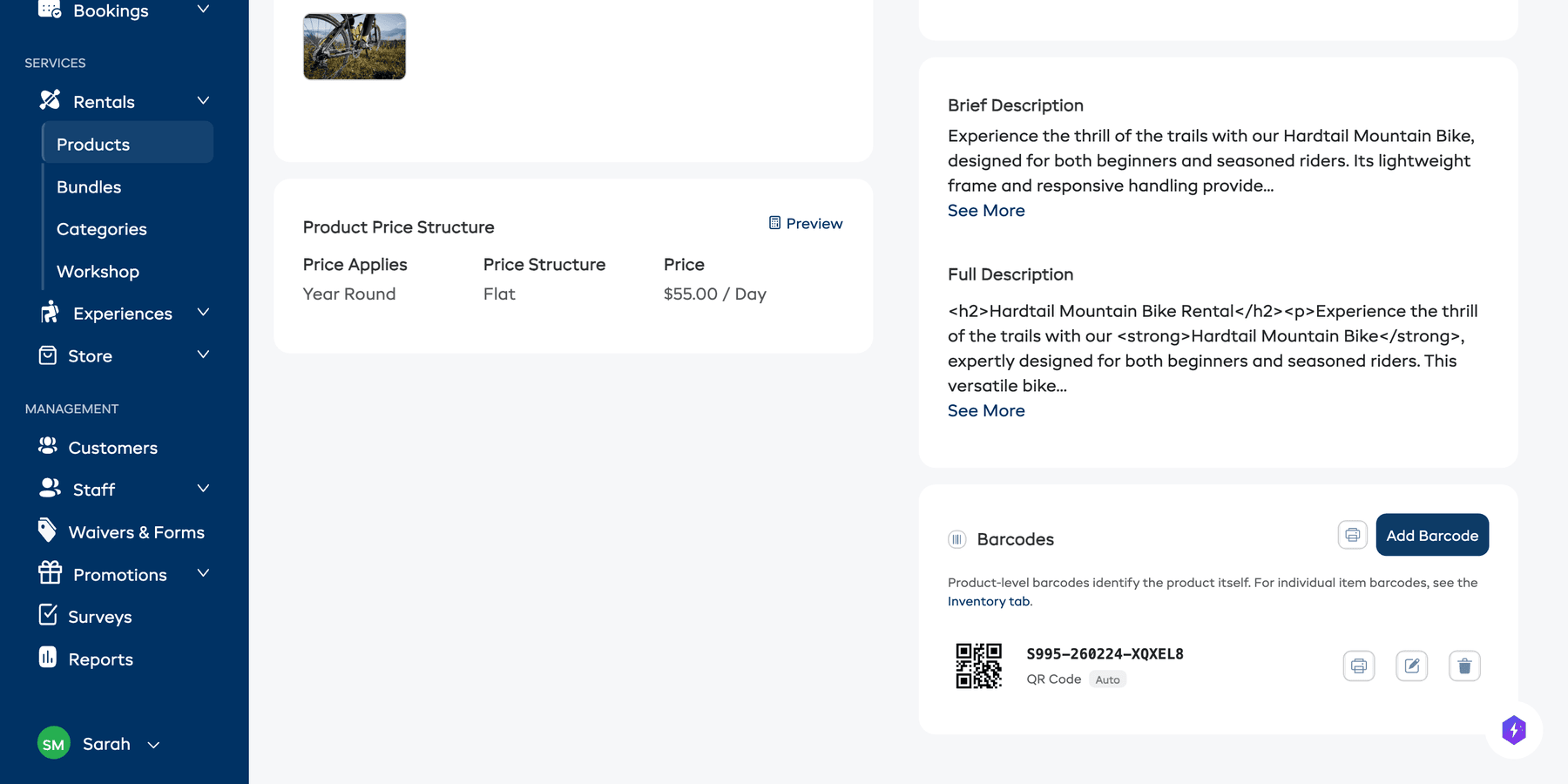 The product detail page showing the Barcodes section with a generated QR code barcode, barcode value, and action icons.