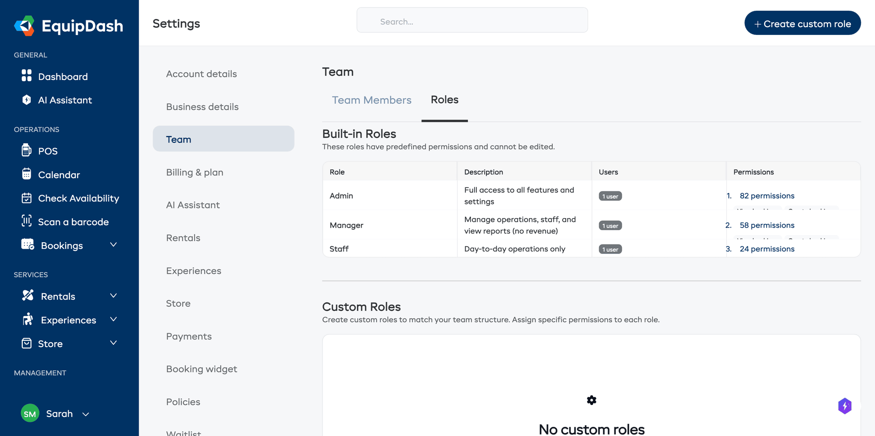 The Team Roles page showing built-in roles with permission counts and custom roles section
