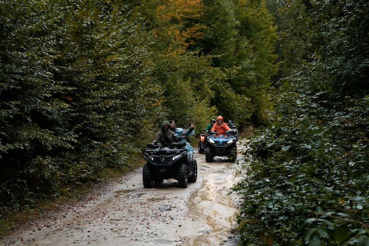 Off-road group returning from a guided ride — deposit hold workflow
