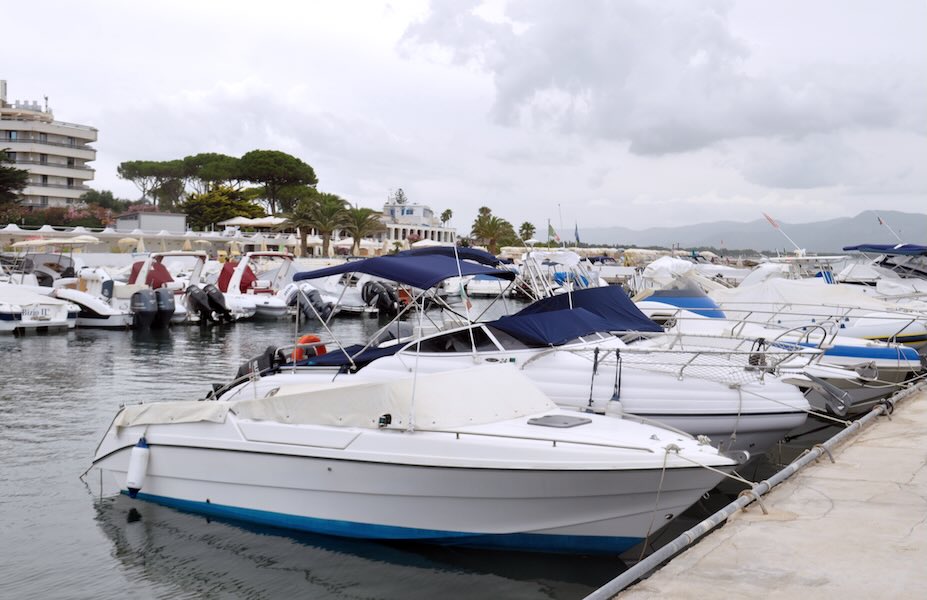 Marina with boat fleet — weather reschedules