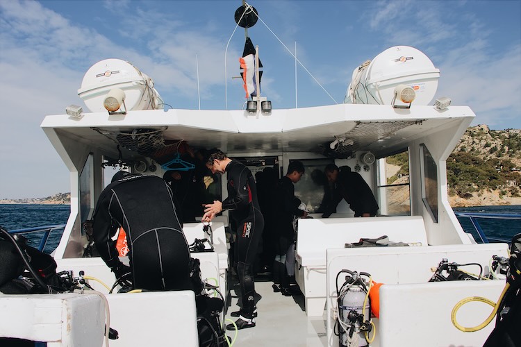 Dive boat on open water — weather reschedules