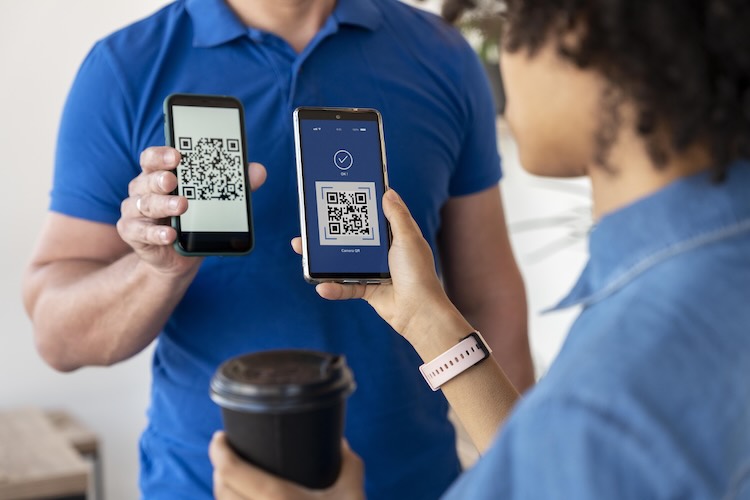 Staff scanning QR ticket on mobile device
